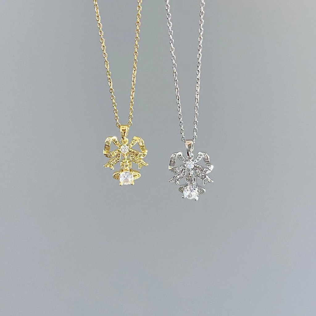 สร้อยคอไทเทเนียมเหล็กชุบ 18K ทองแท้ Micro-Inlaid Zircon Saturn Bow Clavicle Chain สุภาพสตรีเครื่องประดับ