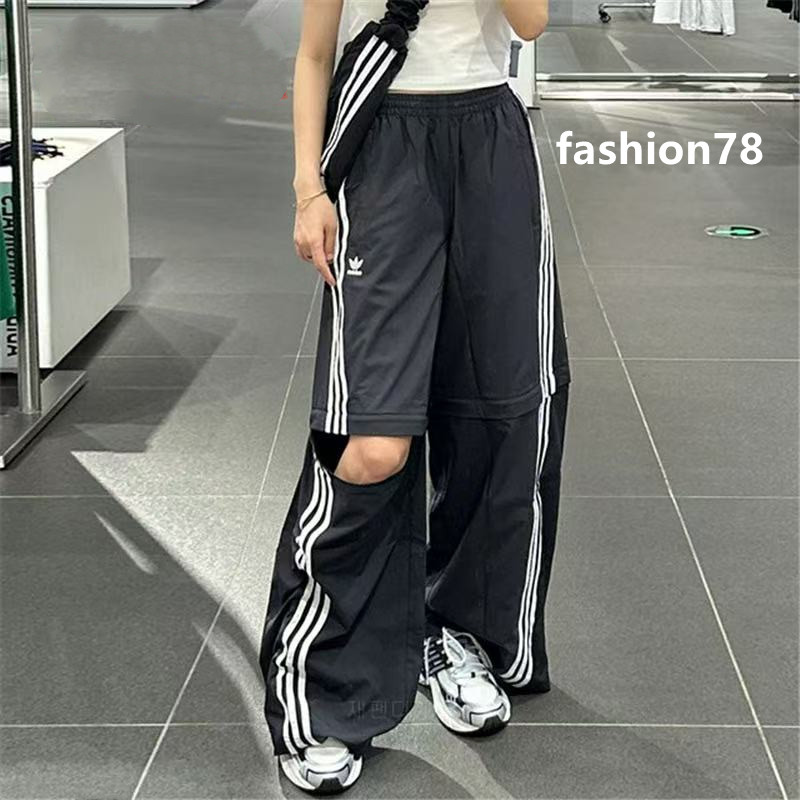 ปักโลโก้กางเกง Unisex กางเกงกีฬากางเกงขาบานขาถอดได้ทรงหลวม