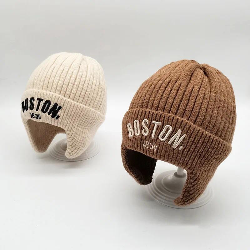 จดหมายเย็บปักถักร้อยเด็กป้องกันหูหมวกเกาหลีฤดูหนาวเด็กสาวหนาอบอุ่นถักเสื้อสวมหัวหมวกกลางแจ้งป้องกันความเย็นเด็ก ฝากระโปรง