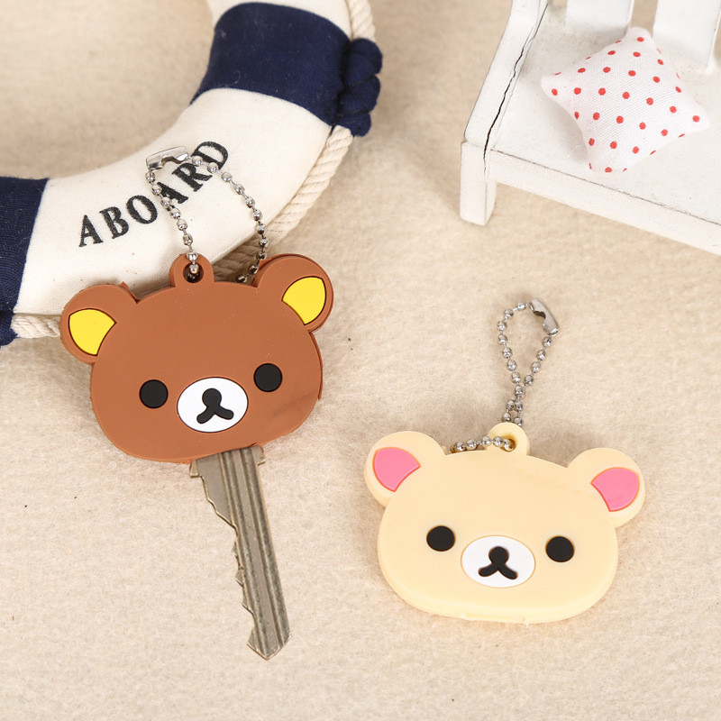 2 ชิ้น Rilakkuma Key ฝาครอบป้องกันพวงกุญแจใหม่อะนิเมะผ่อนคลายหมี PVC กรณีกระเป๋าเป้สะพายหลังแหวนจี้ Charms ของขวัญขายร้อน
