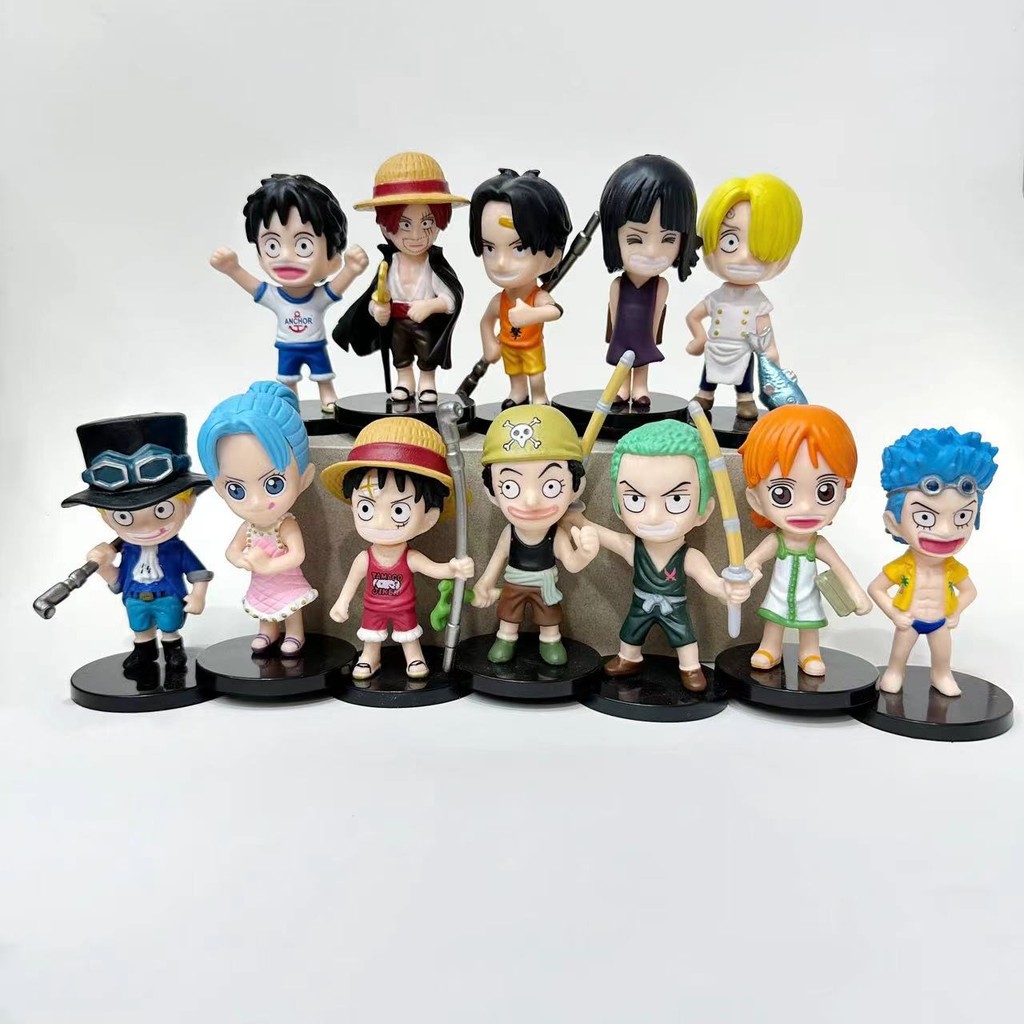 ในวัยเด็ก Little One Piece ทำด้วยมือการ์ตูนอนิเมะลูฟี่เอสซาโบโซรอนของเล่นตุ๊กตานามิผมแดง