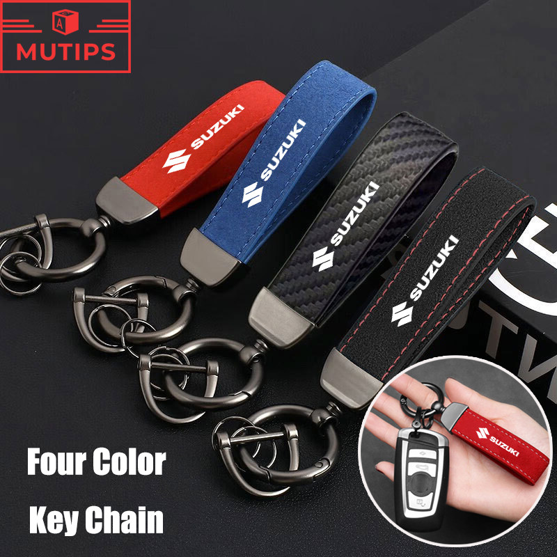 Suzuki พวงกุญแจรถ คาร์บอนไฟเบอร์สีทึบคุณภาพสูง พวงกุญแจโลโก้หนังนิ่ม สําหรับ Jimny Swift Ertiga Celerio XI7 Ciaz