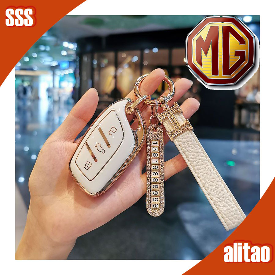 พร้อมแล้ว เคสกุญแจ MG4 EV โบว์ MG ZS MG5 MG HS MG3 โลโก้รถ ตัวป้องกันกุญแจ สายคล้องมือประดับเพชร X4A