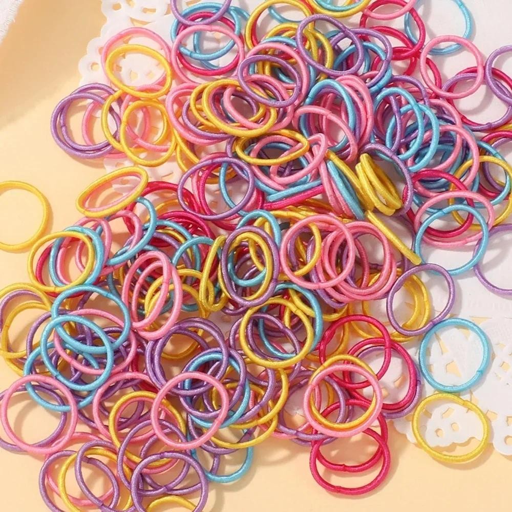 100ชิ้น/ล็อต2เซนติเมตรผูกผมหมากฝรั่งไนล่อนที่มีสีสันยางรัดเชือกตุ๊กตาอุปกรณ์ผมสําหรับเด็กทารกสีดํายืดหยุ่นวงผมของขวัญ
