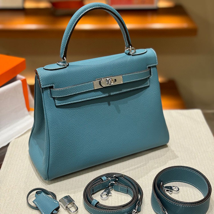 2024 สไตล์ใหม่อินเทรนด์ High-End รู้สึกสายคล้องไหล่กว้าง Kelly กระเป๋าหญิงหนังวัวชั้นแรก One-Shou