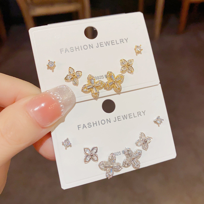 สไตล์เกาหลีประณีตแฟชั่นดอกไม้สี่ใบรวมกันชุดออกแบบต่างหูขายส่ง