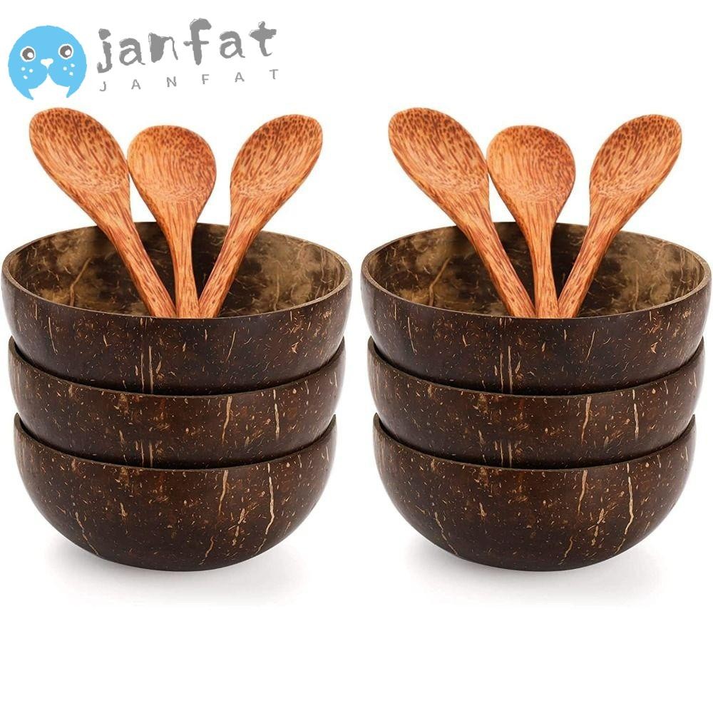 ชามสลัดจันท์ ชามมะพร้าวธรรมชาติไม้พร้อมช้อนกินบนโต๊ะอาหารจานเสิร์ฟกะลามะพร้าวอาหารเช้า