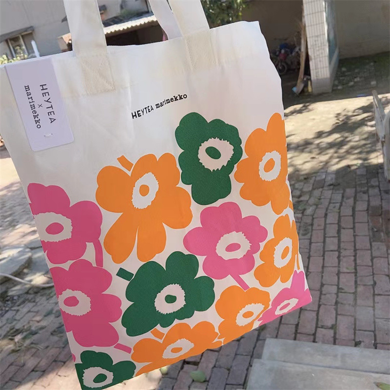 สินค้าใหม่ marimekko Finnish Xicha Co-Branded กระเป๋าผ้าใบบางไหล่เดียวแฟชั่นเป็นมิตรกับสิ่งแวดล้อมกระเป๋าช้อปปิ้งพับ