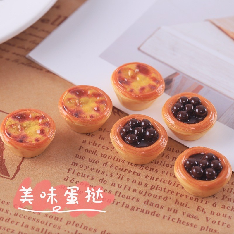 จําลองลูกอมของเล่นทาร์ตไข่ทําเองพวงกุญแจจี้สร้างสรรค์ต่างหูหลุมรองเท้าหัวเข็มขัดวัสดุที่ทําด้วยมืออุปกรณ์เรซินหัวเข็มขัดรองเท้าวั