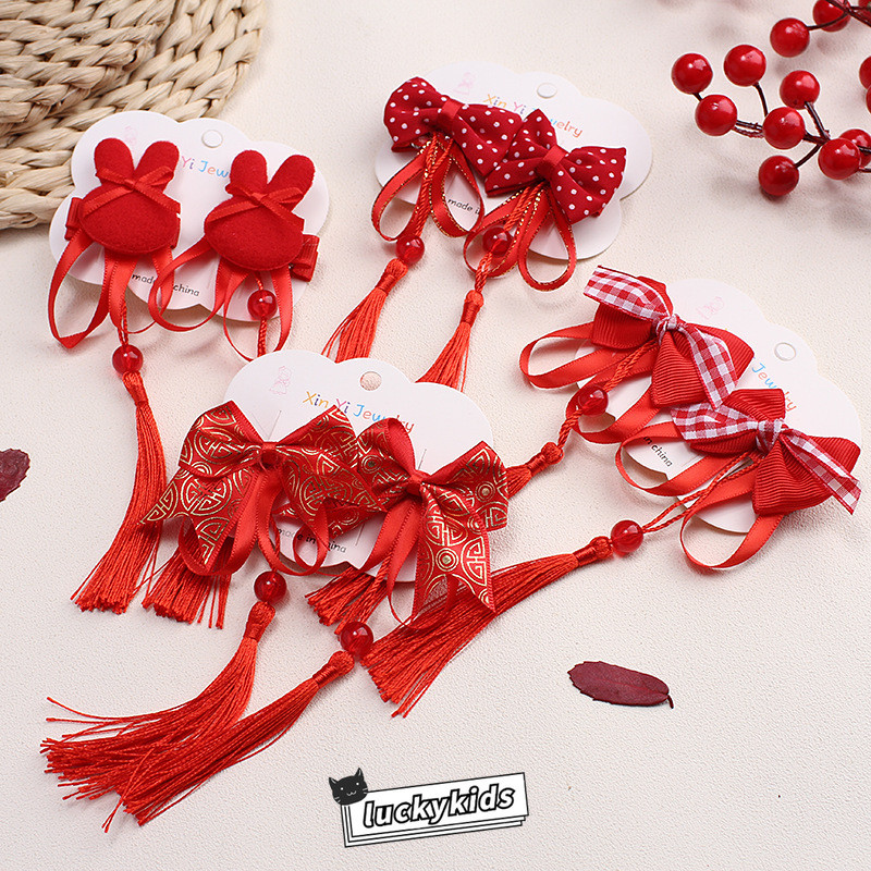 ปีใหม่เด็กสาวสีแดงกุทัณฑ์พู่ออกแบบกิ๊บกิ๊บสไตล์จีน