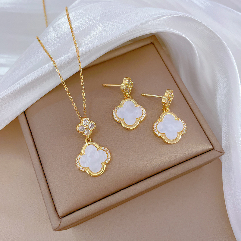 สีดํา/สีขาวอาเกตไทเทเนียมเหล็กผู้หญิงฝังเพทายสี่ใบโคลเวอร์สร้อยคอ/ต่างหูแฟชั่นประณีตชุดเครื่องประดับ
