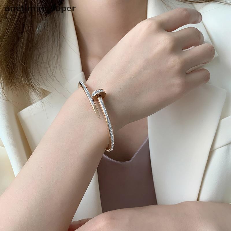 Onetimingsuper เปิดปรับเล็บสแตนเลสประกายเพทายกําไลข้อมือสร้อยข้อมือสําหรับผู้หญิงและผู้ชาย OTP