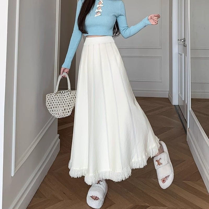 skirt กลางยาวฤดูใบไม้ร่วงและฤดูหนาวอารมณ์ถักหลวมกระโปรงทรงเอกับเส้นด้ายผู้หญิงขนาดบวกพู่เอวสูงครึ่งความยาวกระโปรง – โปรปัง