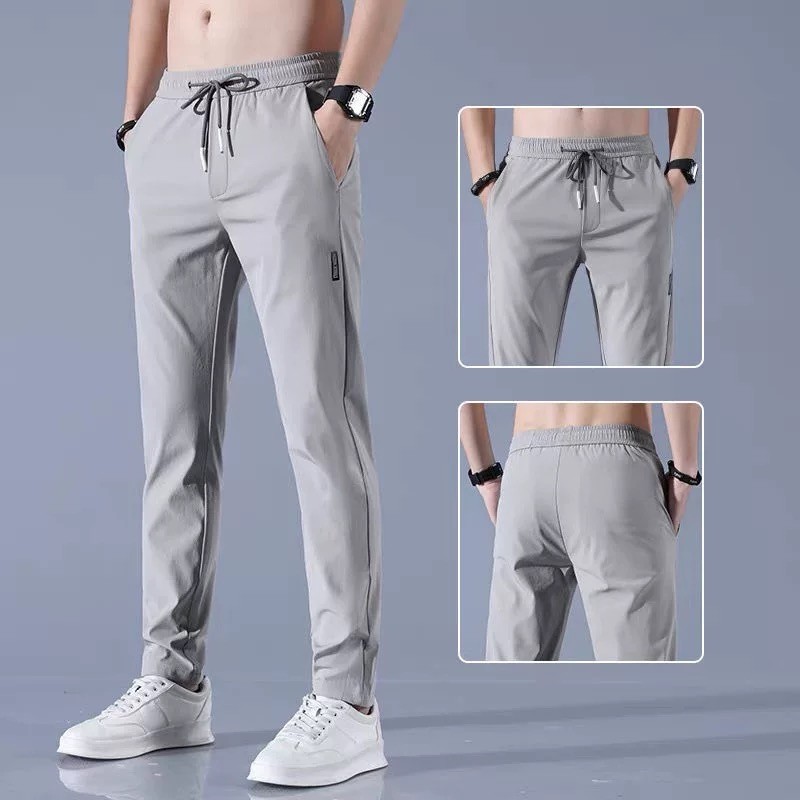 [ซื้อ 1 เอา 2] ม-5เอ็กแอล กางเกงผ้าไหมน้ําแข็งสําหรับผู้ชายและผู้หญิงแฟชั่นเกาหลีสลิมฟิตตรงขาสีทึบกางเกงขายาวหลวมสบายๆพื้นฐานธรรมดากางเกงทุกการแข่งขัน กางเกงวอร์ม สีดํา\สีเทา