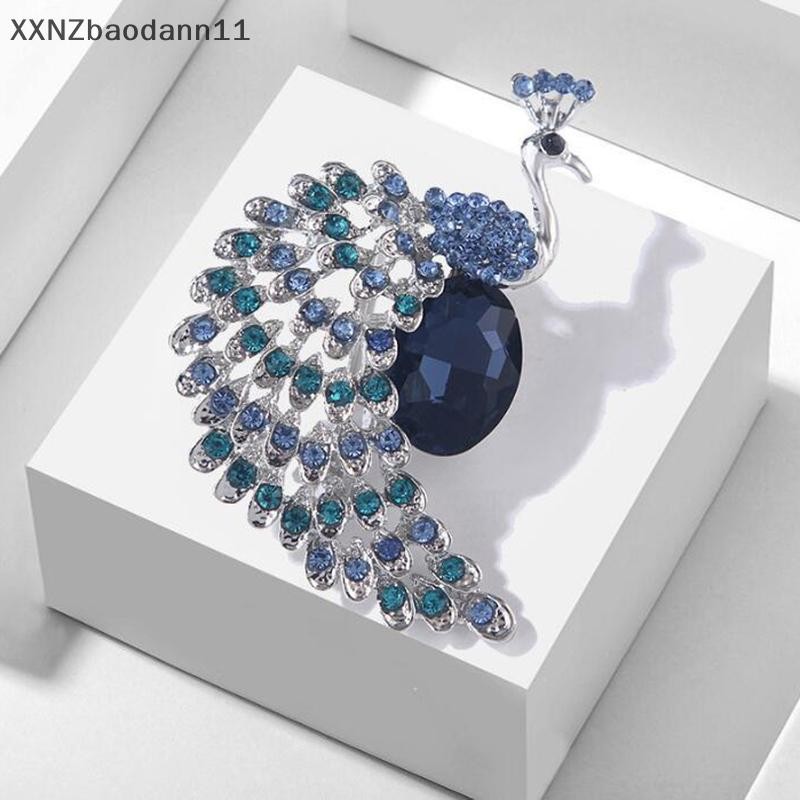 Xnz ประณีตสีฟ้าประกายเพชรผีเสื้อเข็มกลัดสําหรับสาวอารมณ์เพทายสัตว์เสื้อยกทรงแฟชั่นพรรคเครื่องประดับของขวัญ ฯลฯ