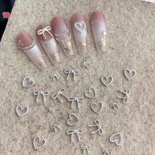 Renbg 10pcs โลหะผสม Bowknot Love เล็บ Art Charms ตกแต่ง 3D โลหะหรูหรา Silver Bows รูป Jewellery DIY เล็บออกแบบอุปกรณ์ TH