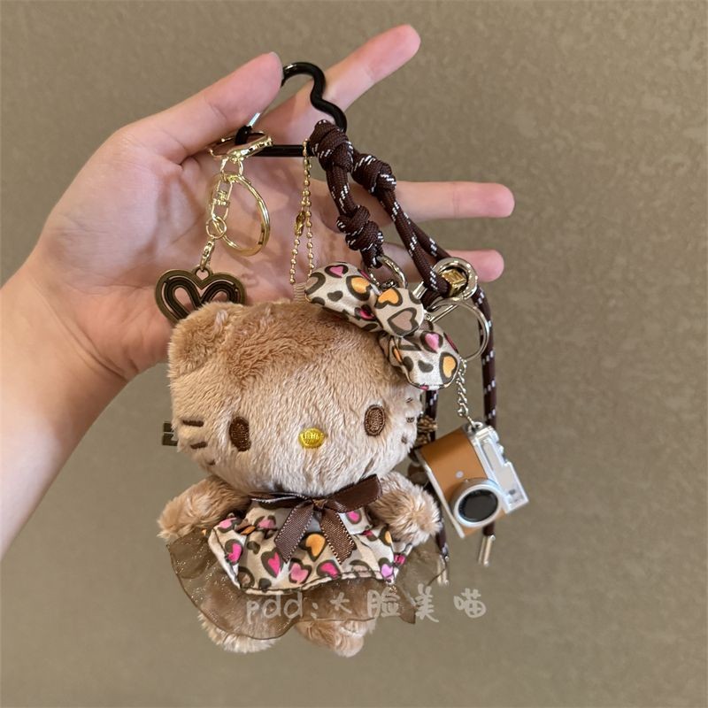 Hello Kitty ตุ๊กตาตุ๊กตาตุ๊กตากระเป๋าจี้พวงกุญแจการ์ตูนเสือดาวพิมพ์ตุ๊กตาจี้ของขวัญสําหรับเด็กผู้หญิง