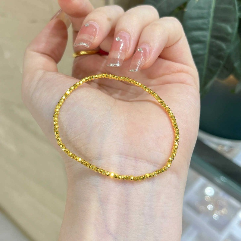 สร้อยข้อมือเหล็กไทเทเนียมคุณภาพสูงไม่สม่ําเสมอหักทอง 18K Gold-plated ยืดหยุ่นสร้อยข้อมือลูกปัดทองขนาดเล็กสาวสร้อยข้อมือของขวัญขายส่ง