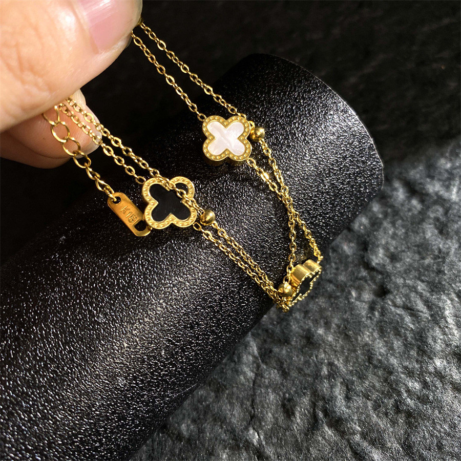 ญี่ปุ่นสไตล์เกาหลีสองชั้นสีดําสีขาวเชลล์สองด้านโคลเวอร์สี่ใบไทเทเนียม - รูปที่ 2