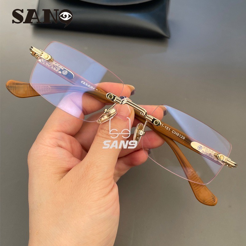 สินค้าพร้อมCOD (San9) ใหม่ทันสมัยและอเนกประสงค์ Retro Perforated Frameless การออกแบบแบรนด์กรอบแว่นตาส่วนบุคคลสําหรับผู้ชายและผู้หญิง