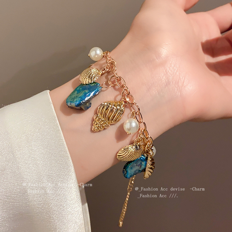 [จูวบิวตี้]สร้อยข้อมือมุกเปลือกหอยสังข์สไตล์วันหยุดชายทะเลแสงหรูหราแฟชั่นระดับไฮเอนด์ผู้หญิงวาดด้วยมือ