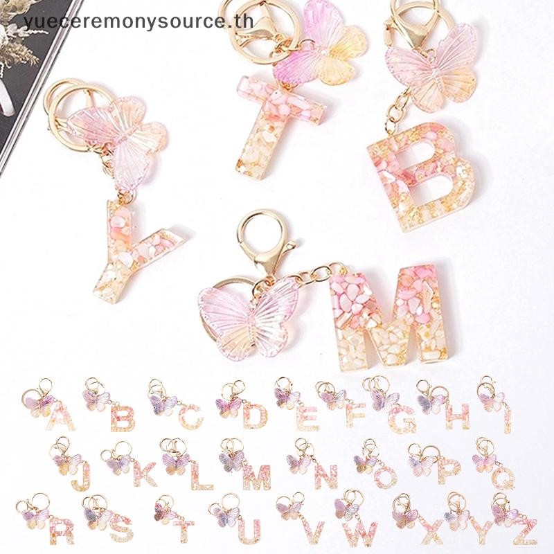 SELL Best Pink Dream Butterfly 26 ตัวอักษร A ถึง Z พวงกุญแจเรซิ่น 26 เริ่มต้นหินสีขาว Gold Leaf จี้พวงกุญแจกระเป๋าเป้สะพายหลัง Charm กระเป๋าตกแต่ง ~