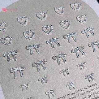 Renbg 10pcs โลหะผสม Bowknot Love เล็บ Art Charms ตกแต่ง 3D โลหะหรูหรา Silver Bows รูป Jewellery DIY เล็บออกแบบอุปกรณ์ TH