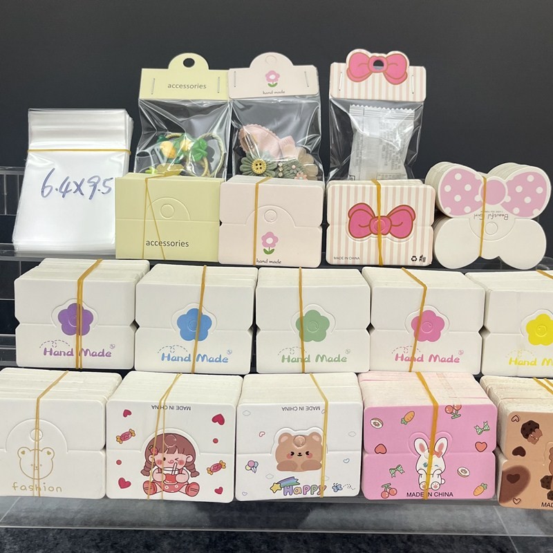 100ชิ้นน่ารักสีชมพูป้ายกระดาษแท็กบัตรพับหลุมแฮนด์เมด สวัสดี คลิปสตั๊ดต่างหูเครื่องประดับบรรจุภัณฑ์แสดงกระเป๋าขนาดเล็ก ธุรกิจ อุป