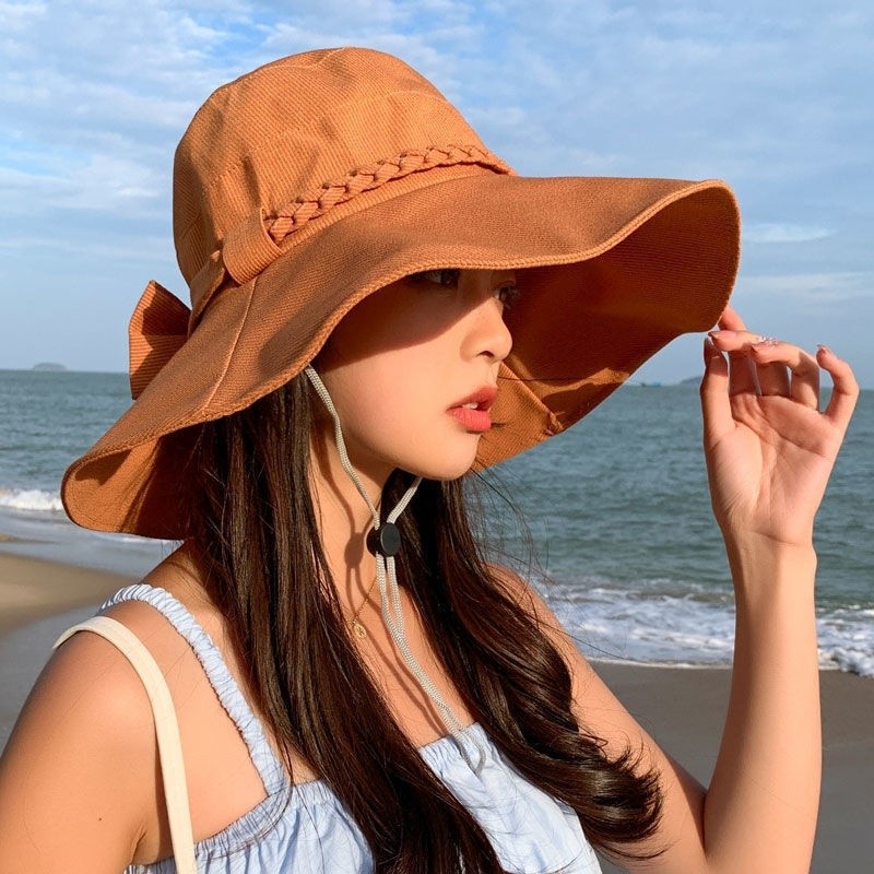 ฤดูร้อนป้องกันรังสียูวีดวงอาทิตย์หมวกปีกใหญ่พับโบว์แฟชั่นผู้หญิงชายหาดกันแดดหมวกผู้หญิงใหม่