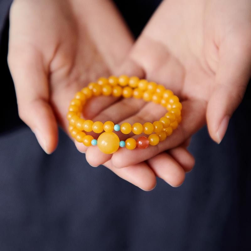 สร้อยข้อมือขี้ผึ้งน้ํามันไก่ผู้หญิงสีเหลืองสีเหลืองอําพันภาคใต้สีแดงลูกปัดทานาบาตะสร้อยข้อมือวงกลมคู