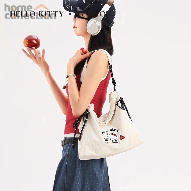 toutou x hello kittyกระเป๋า 2025กระเป๋าโท้ทสไตล์ใหม่ความจุขนาดใหญ่สไตล์เกาหลีสไตล์ขี้เกียจกระเป๋าผ้าใบ