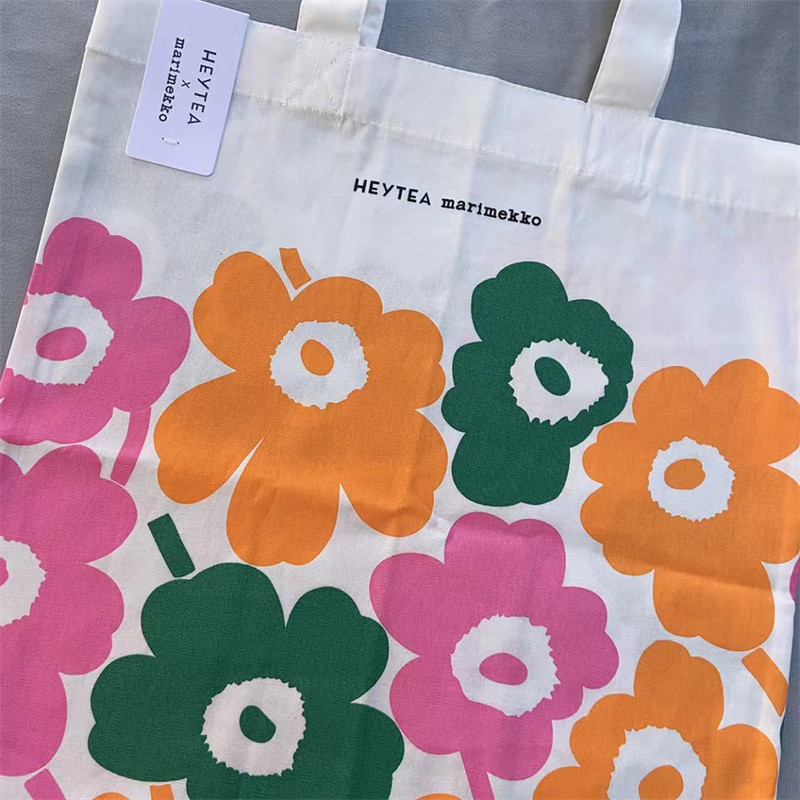 สินค้าใหม่ marimekko Finnish Xicha Co-Branded กระเป๋าผ้าใบบางไหล่เดียวแฟชั่นเป็นมิตรกับสิ่งแวดล้อมกระเป๋าช้อปปิ้งพับ