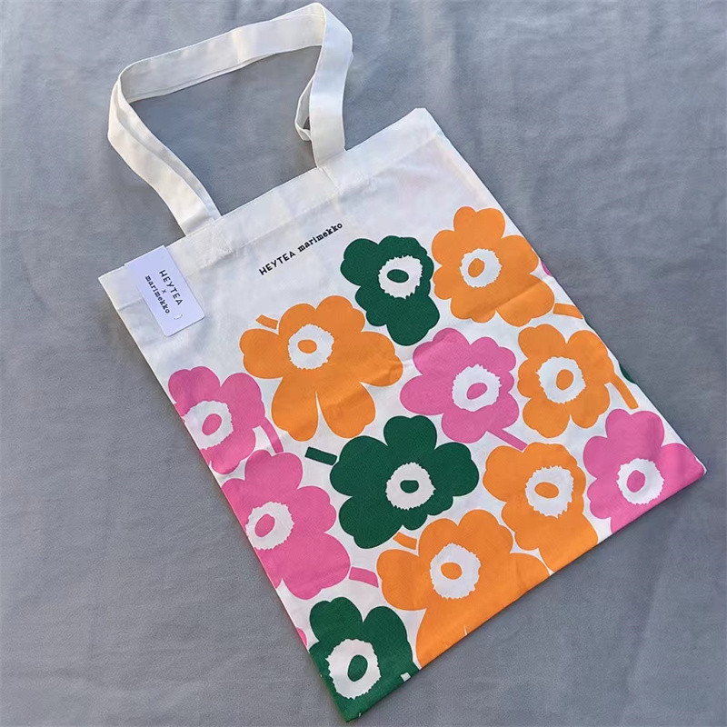 สินค้าใหม่ marimekko Finnish Xicha Co-Branded กระเป๋าผ้าใบบางไหล่เดียวแฟชั่นเป็นมิตรกับสิ่งแวดล้อมกระเป๋าช้อปปิ้งพับ
