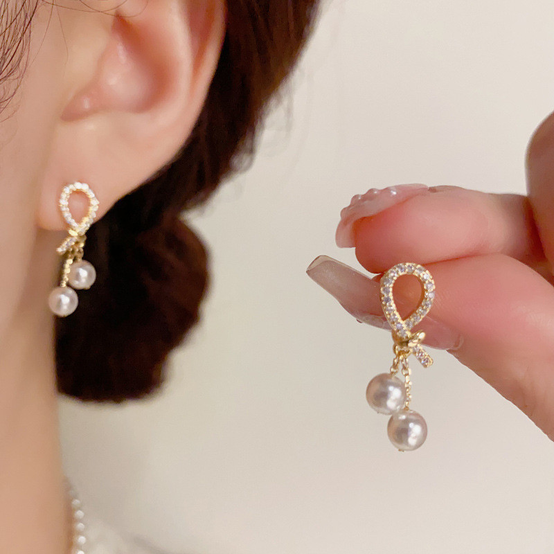 7vio Micro-Inlaid Zircon Knot Pearl Light สไตล์หรูหราทุกวัน Commuter สไตล์การออกแบบเฉพาะต่างหูอารมณ์แฟชั่นต่างหู