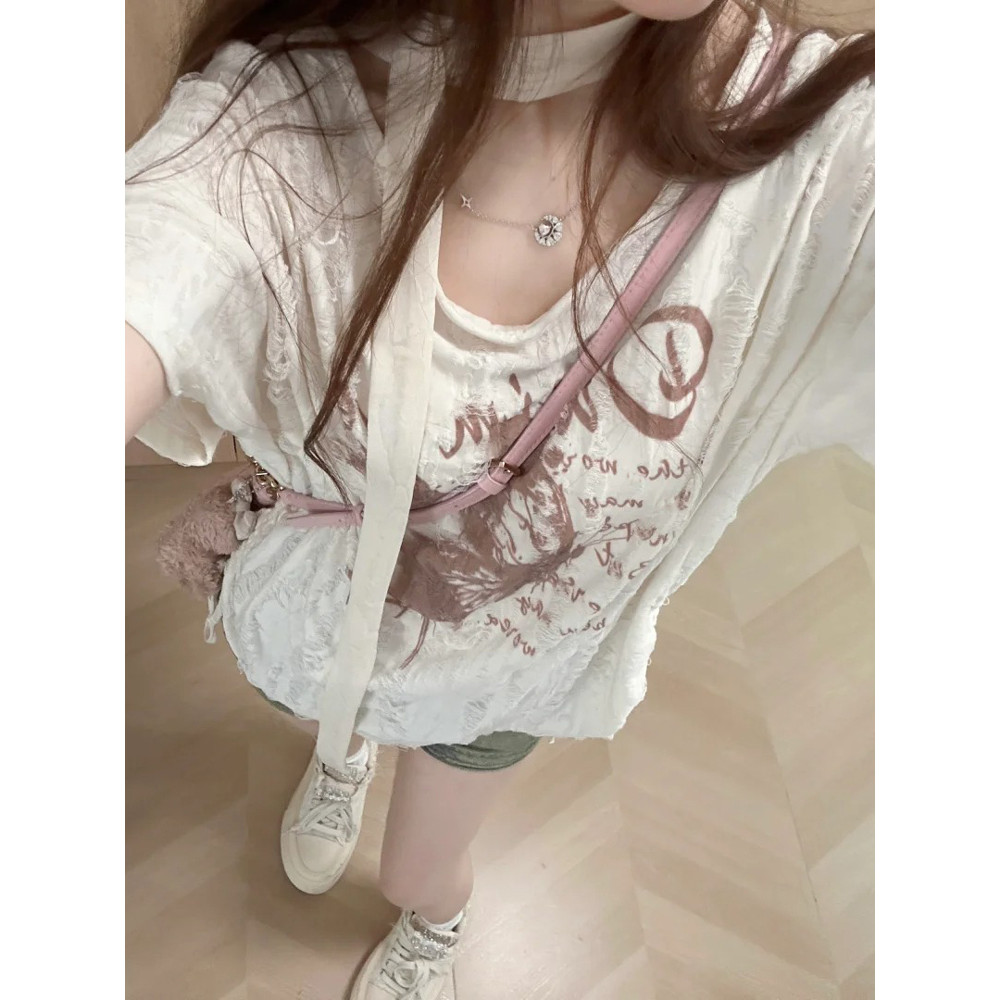 เสื้อยืดแขนสั้นคอกลมสีแอปริคอทสำหรับผู้หญิงเสื้อพิมพ์ลายแบบมีรูขาดใส่แล้วดูผอมแบบบางใส่แล้วดูผอมแมทช