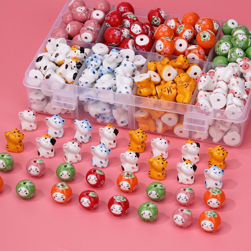 เซรามิค Lucky Cat Persimmon Ruyi diy สร้อยข้อมือทอมือสร้อยคอลูกปัดโทรศัพท์มือถือจี้แนวตั้งหลุมอุปกรณ