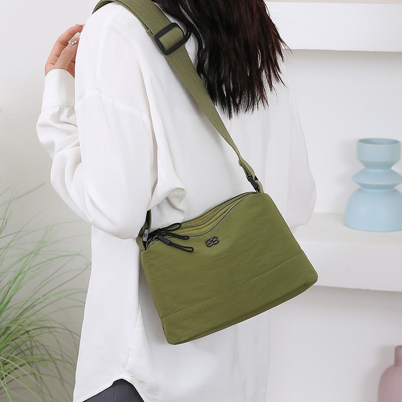 กระเป๋าเป้สะพายหลัง 여성 แบบใหม่ ดีไซน์ไม่ซ้ำใคร ทำจากไนลอน มีความจุมากและน้ำหนักเบา มาพร้อมหลายชั้นสำหรับเก็บของสะดวกสบาย - รูปที่ 4