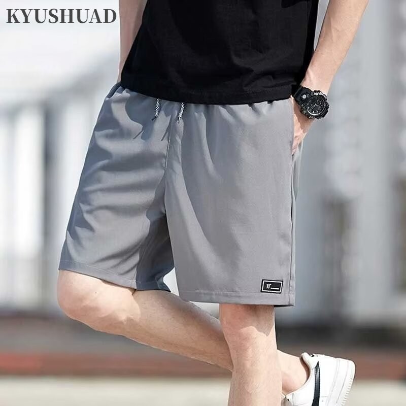 KYUSHUAD คิวชวด ใหม่ผู้ชายเกาหลีย้อนยุคลําลองชุดทํางานระดับไฮเอนด์ที่มีกระเป๋าหลายช่องทรงหลวมสปอร์ตว