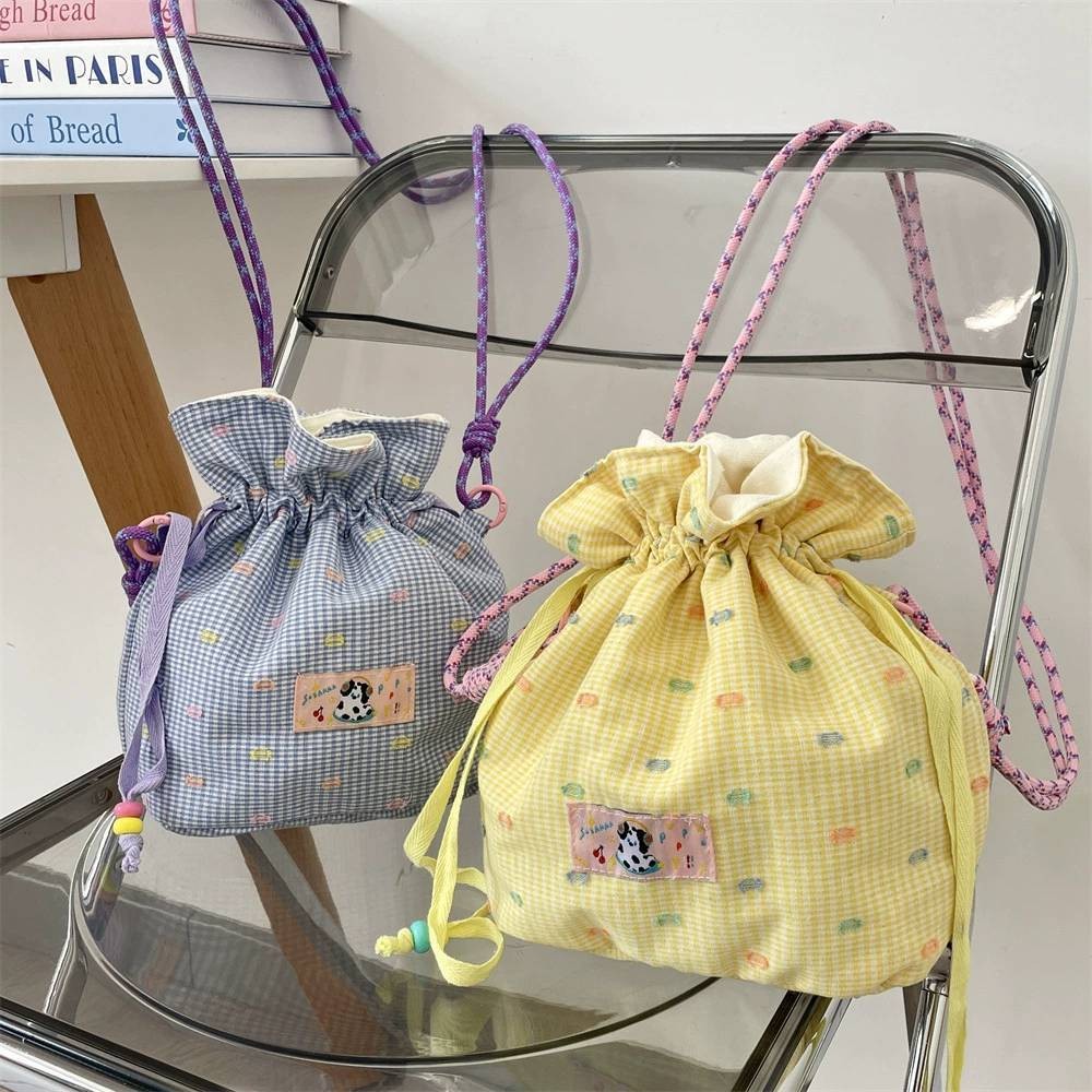 AMIKABAG(MK2385) กระเป๋าสะพายข้างทรงขนมจีบ สายเชือกสีน่ารัก ขนาด13.5นิ้ว