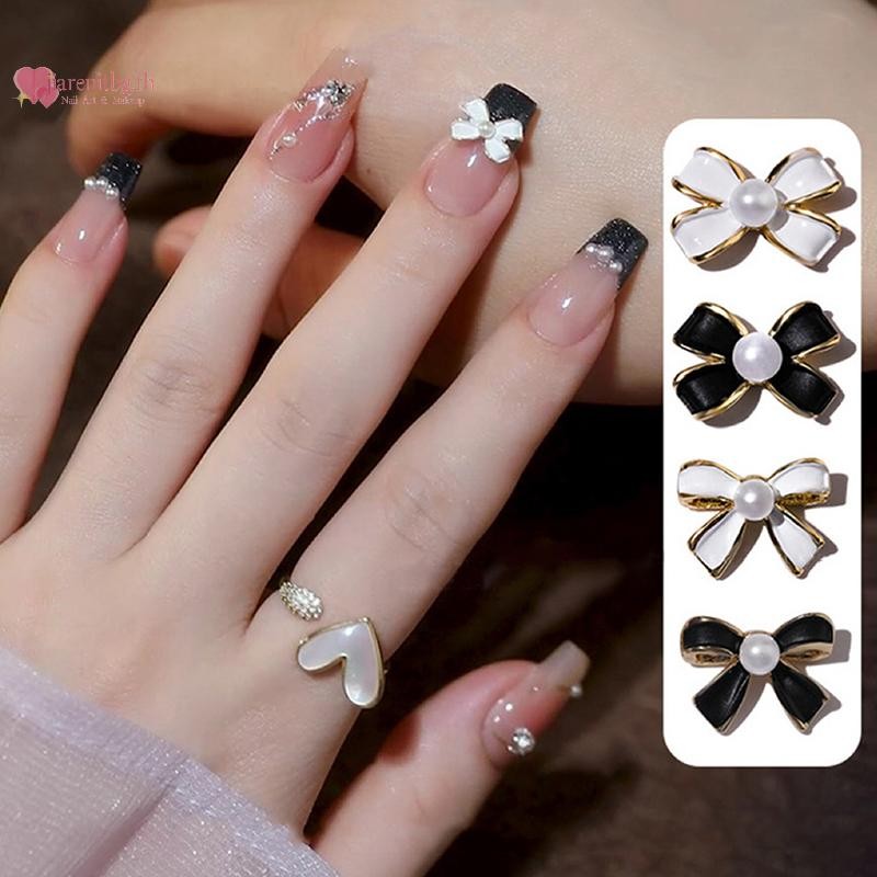 RENBG 10PCS Vintage Simple Bow Tie Charms คลาสสิกสีดําสีขาวมุกฝัง Bowknot โลหะผสมเล็บ Rhinestone ตกแต่งเล็บ Salon TH - รูปที่ 2