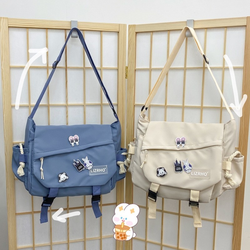 สไตล์เกาหลีอินเทรนด์กระเป๋าสะพายความจุขนาดใหญ่ญี่ปุ่นย้อนยุคผู้หญิงสีทึบ Mailman นักเรียนไนลอน Crossbody