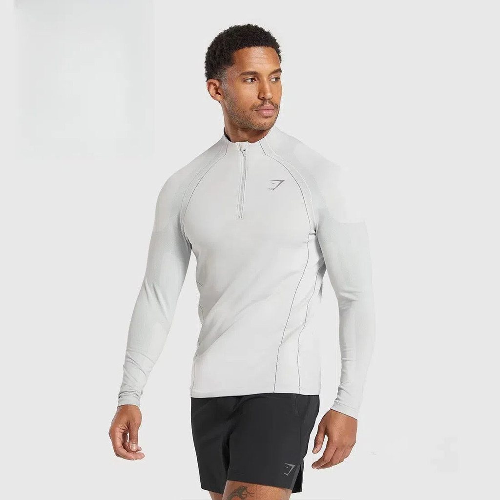 Shark GYMSHARK สไตล์เดียวกัน APEX SEAMLESS 1/4 เสื้อยืดแขนยาวผู้ชายฟิตเนสกีฬา