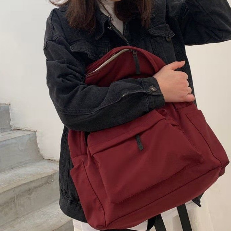 กระเป๋าเป้สะพายหลังความจุขนาดใหญ่แฟชั่นญี่ปุ่นสําหรับเด็กผู้หญิงสีทึบย้อนยุคเรียบง่ายนักเรียนอินเทรนด์ใหม่ลําลองอเนกป - รูปที่ 2