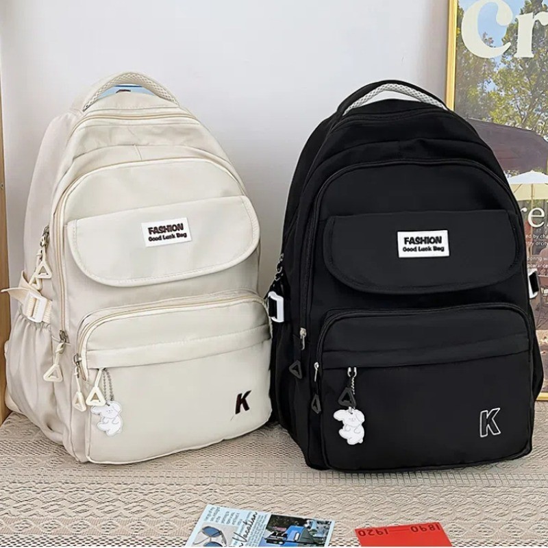 แฟชั่น ใหม่ความจุขนาดใหญ่หลายช่องน้ําหนักเบานักเรียนกระเป๋าเป้สะพายหลังสีทึบสบายๆอเนกประสงค์ การท่องเที่ยว