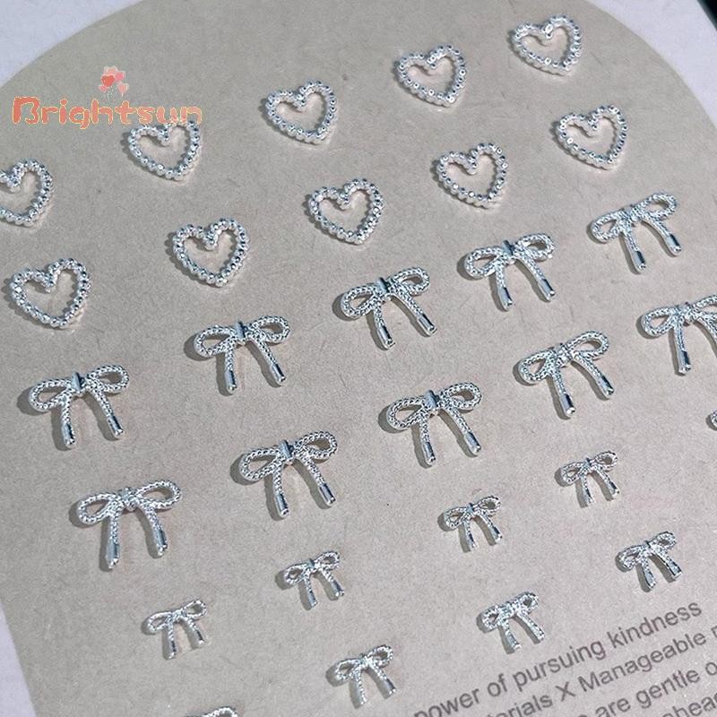 Brightsun 10pcs โลหะผสม Bowknot Love เล็บ Art Charms ตกแต่ง 3D โลหะหรูหรา Silver Bows รูป Jewellery DIY เล็บออกแบบอุปกรณ์ใหม่