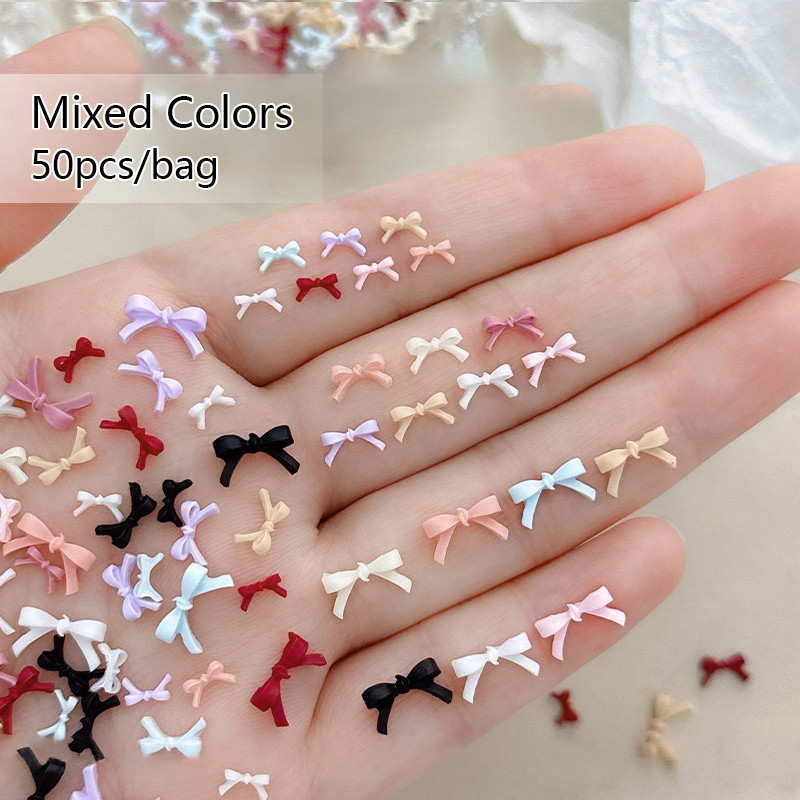 50PCS หลายสี Mini เรซิ่น Bowknots เล็บ Charms 3D Minimalist น่ารักสาย Bows ตกแต่งเล็บสําหรับ DIY หวานเล็บ