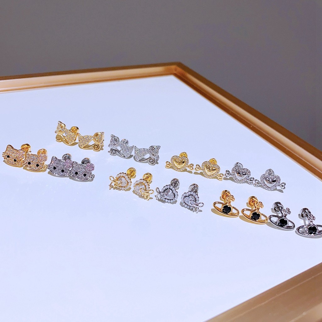 ต่างหู เหล็กไทเทเนียมชุบทองคําแท้ Non-Fading Micro-Inlaid Zircon Love Cat Saturn สกรูต่างหูขนาดเล็ก