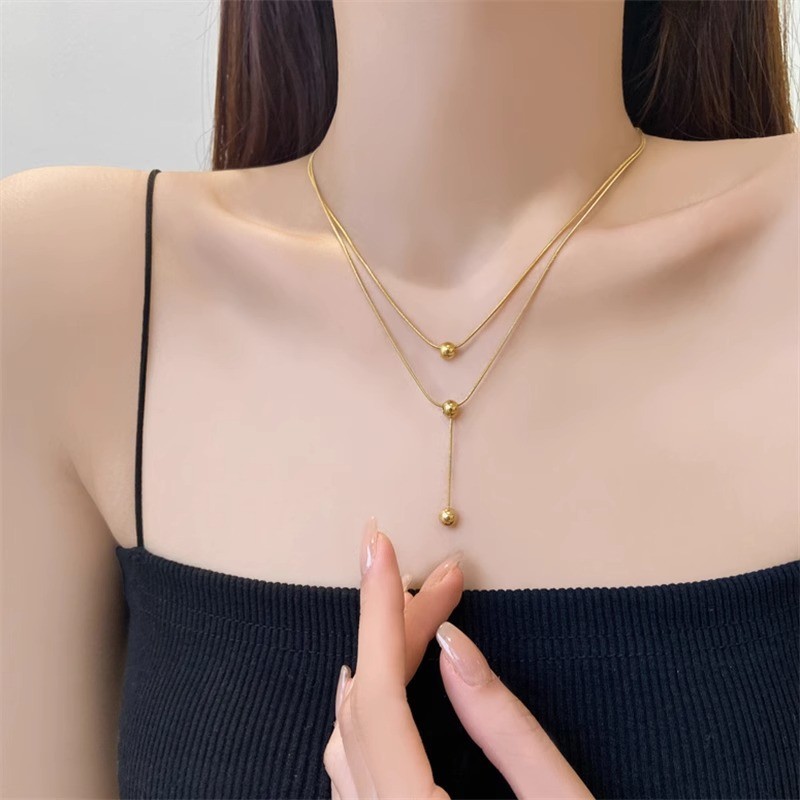 หญิง Niche High-End Design ลูกปัดกลมขนาดเล็กไทเทเนียมเหล็ก Double-Layer Clavicle Chain สไตล์ใหม่อินเทรนด์อุปกรณ์เสริมที่เรียบง่าย