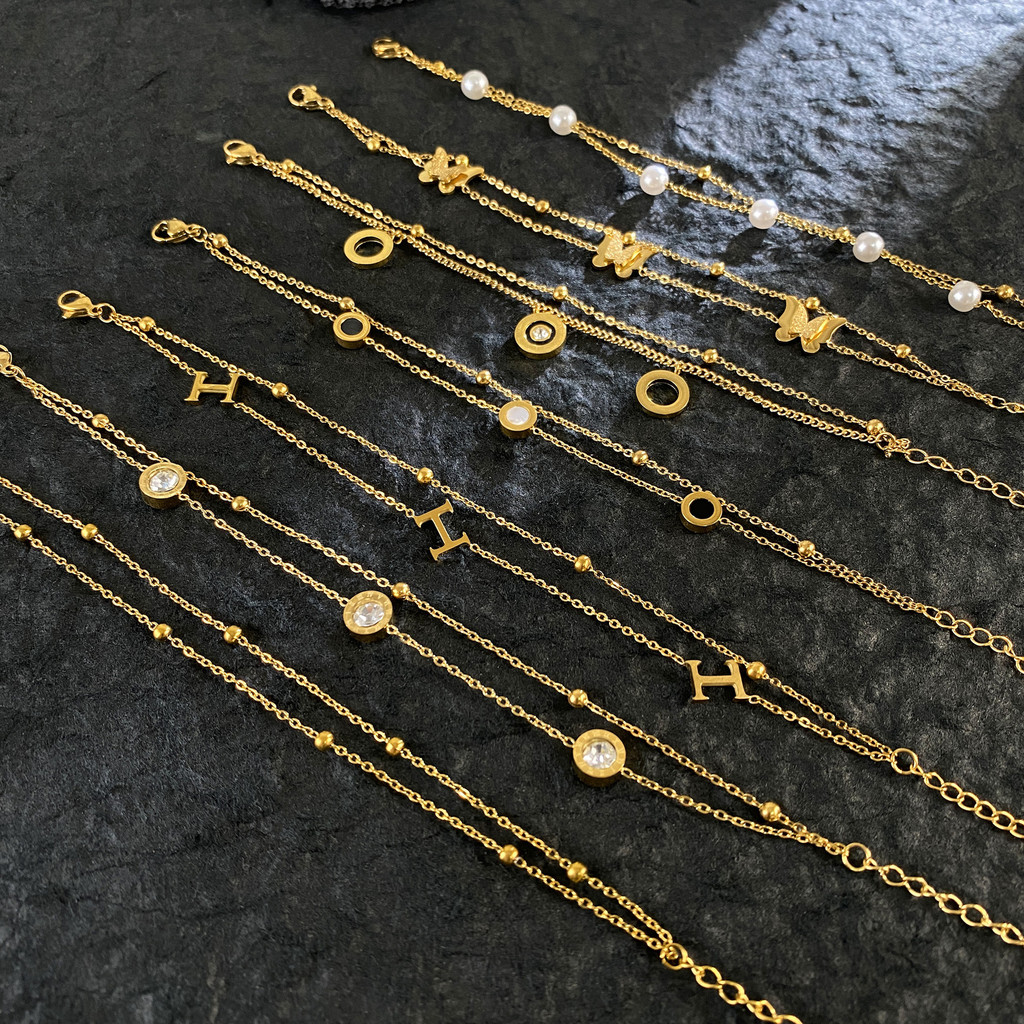 สร้อยข้อมือผีเสื้อไทเทเนียมชุบทอง 18K สไตล์หรูหรา แต่งานเรียบง่าย เหมาะสำหรับสวมใส่ทุกวัน