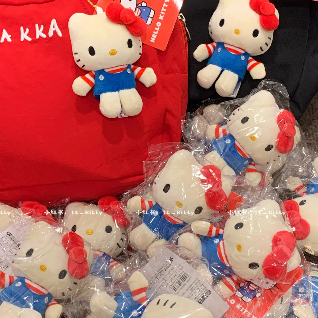 น่ารักสีแดงสีฟ้าลายคิตตี้กระเป๋าจี้ตุ๊กตาน่ารักจี้จี้กระเป๋านักเรียน